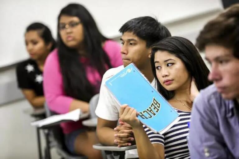 Image of a row of a racially diverse group of California high school students  