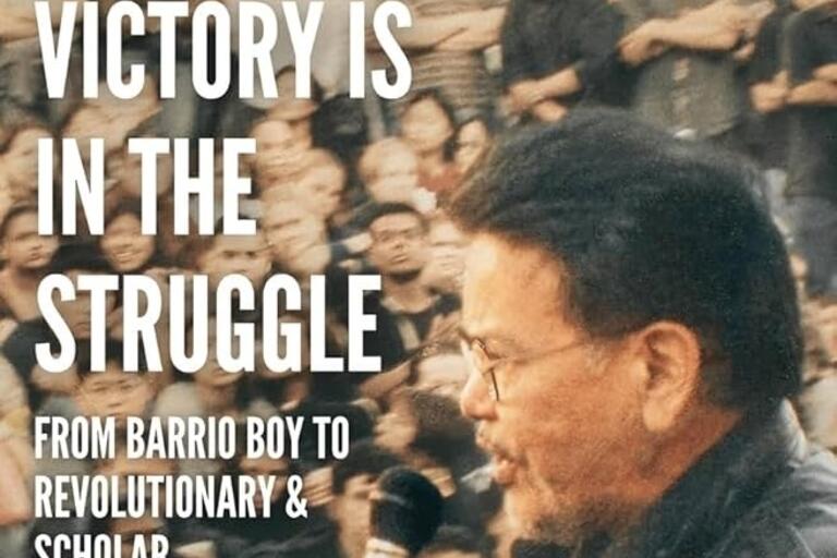 Cover of the book "Victory is in the Struggle," featuring Carlos Muñoz speaking into a microphone